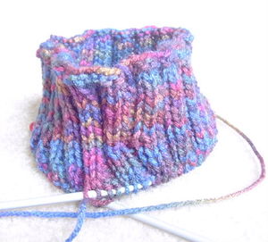 Knitting using a circular needle.