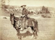 A cowboy, circa 1887, wearing shotgun style chaps