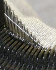 A modern industrial knitting machine in action